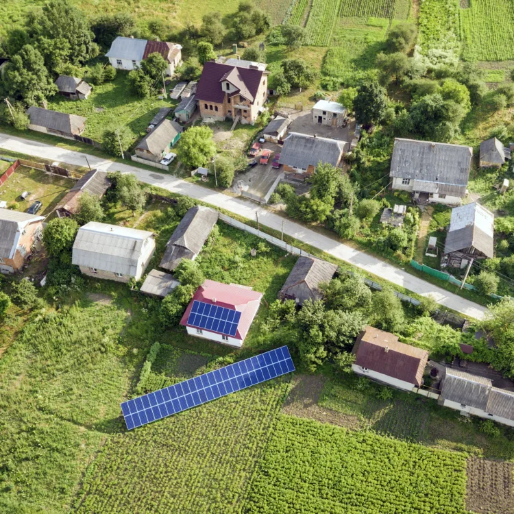 Aerial view of a house with blue solar panels for 2024 12 06 02 32 23 utc
